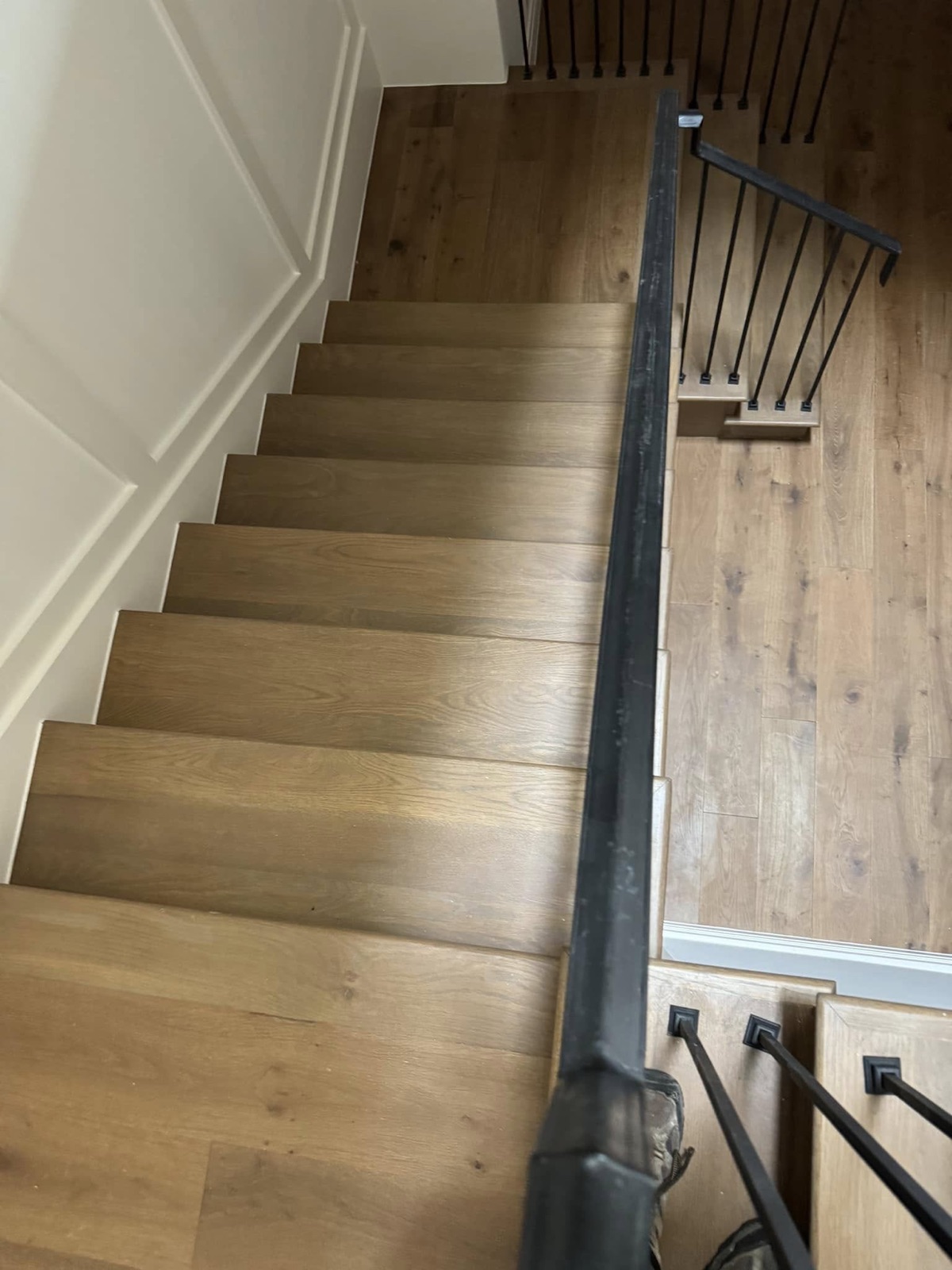 White oak staircase with black iron railing