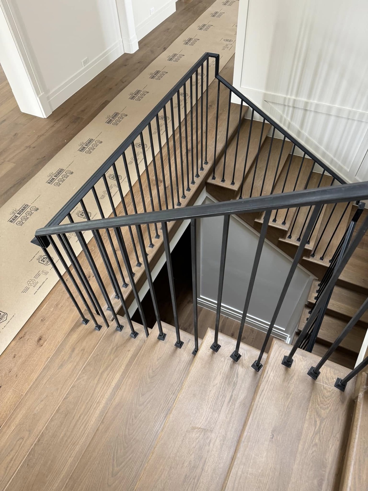 Oak staircase and landing from above, protected during installation